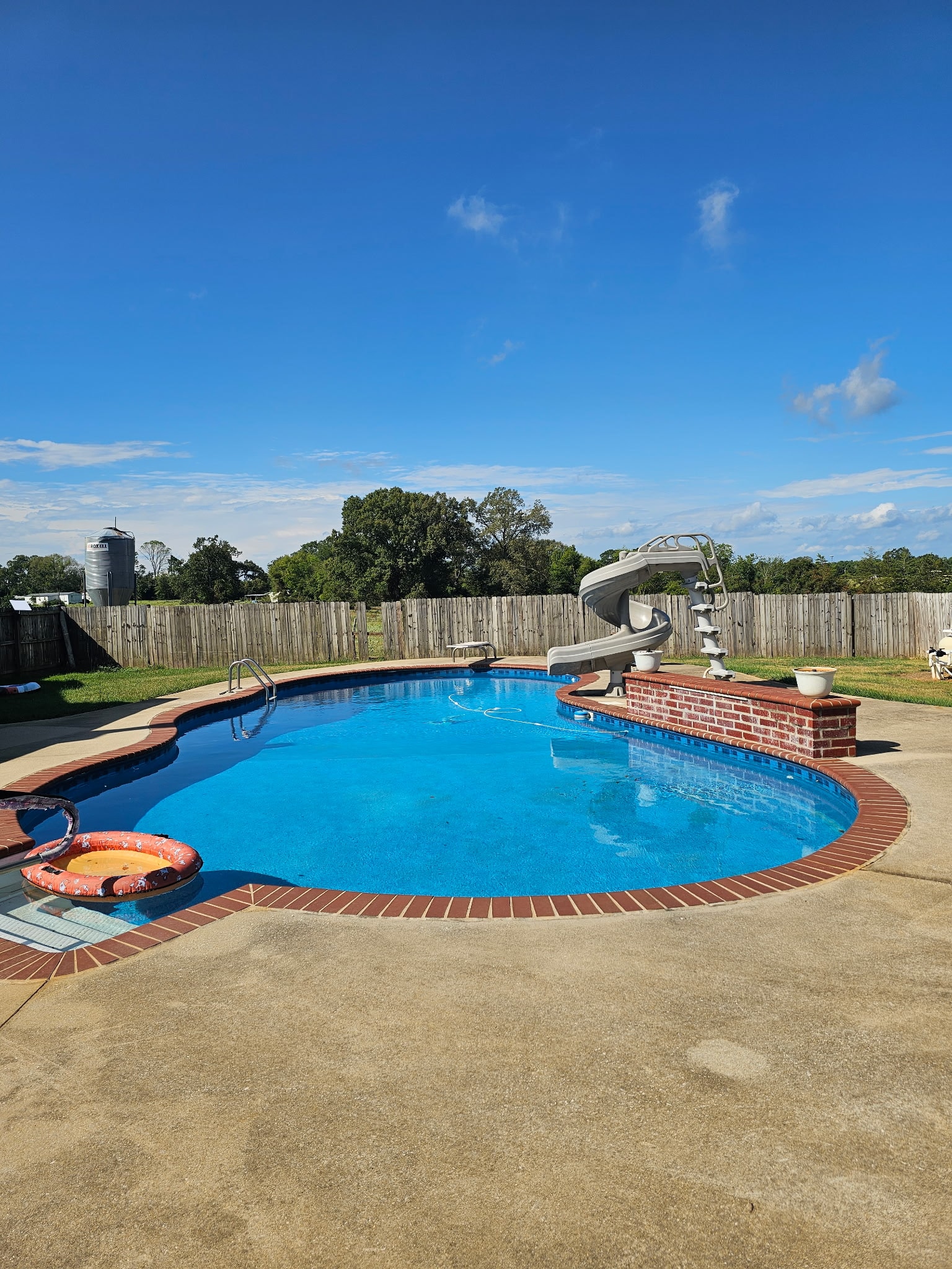 Pool with brick coping and water slide